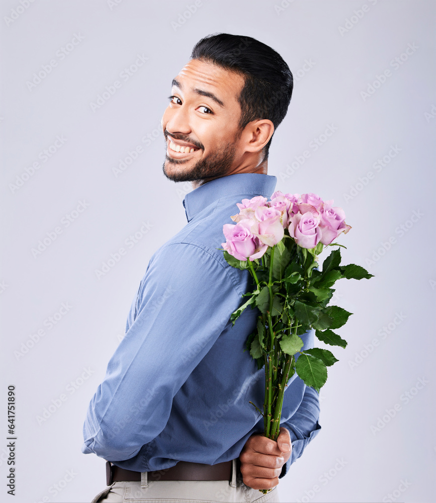 Flowers, portrait and man in studio with surprise roses in celebration of valentines day or romance 