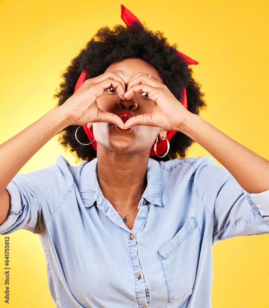 Heart, sign and happy black woman with love hand gesture as support and care isolated in a studio ye