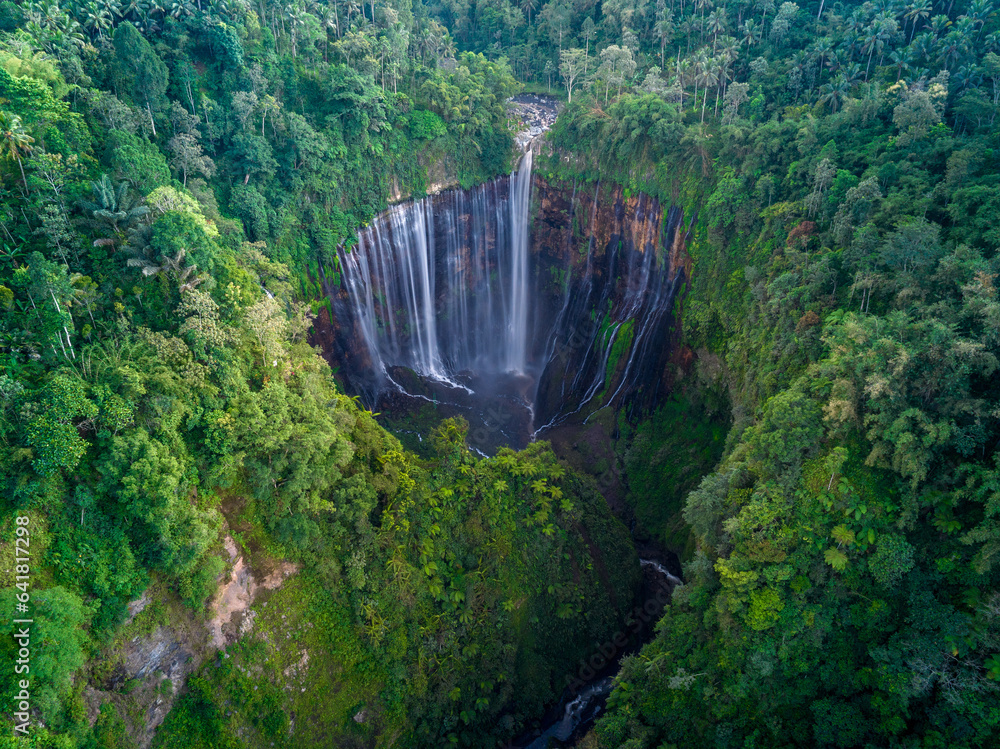 Aerial top view from above of Tumpak Sewu ,also known as Coban Sewu, 120m high waterfall in Malang r