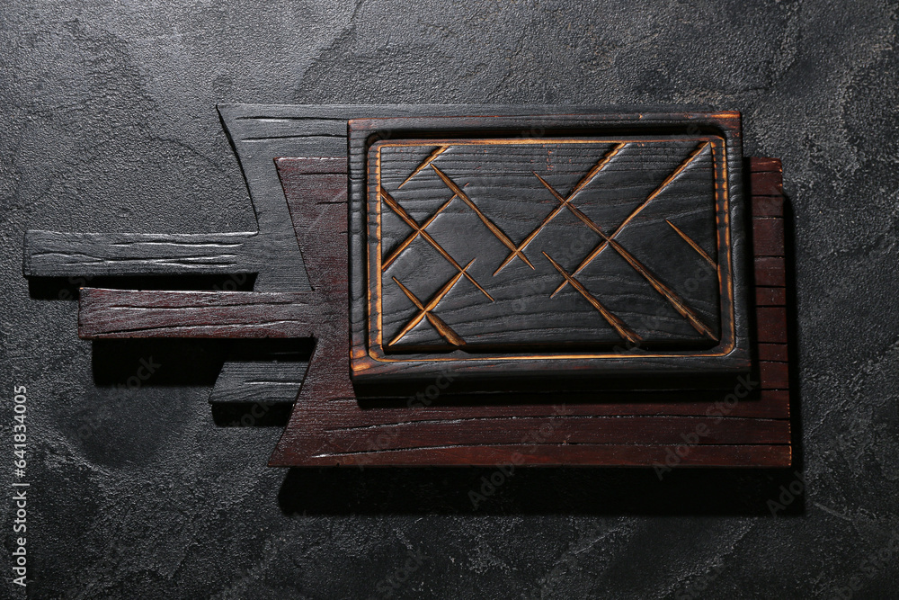 Wooden cutting boards on black background