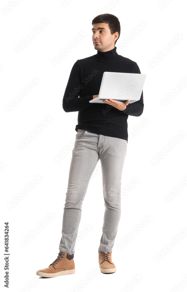 Young businessman working with laptop on white background