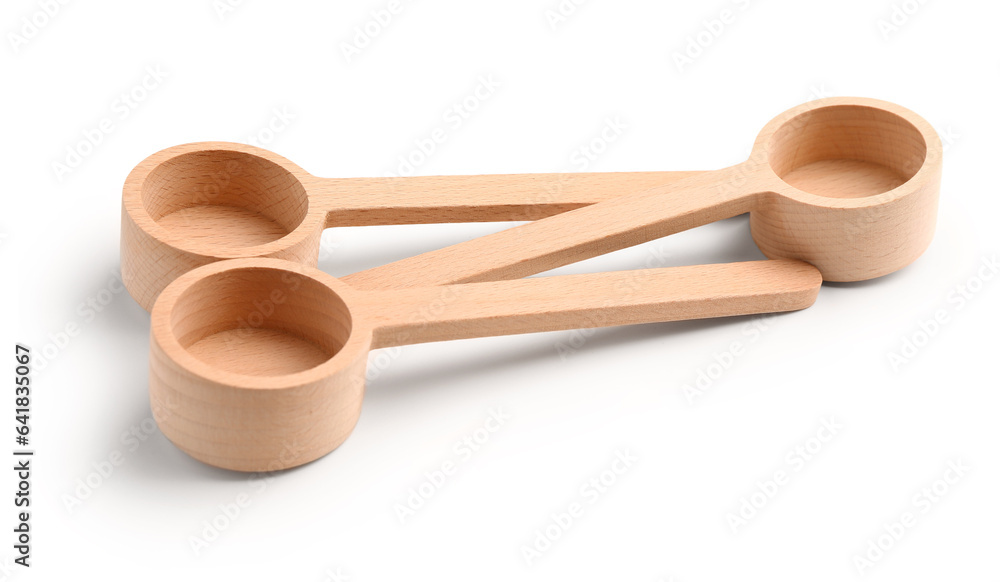 Empty wooden scoops isolated on white background