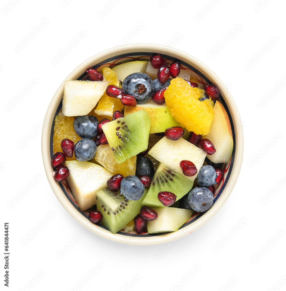 Bowl with fresh fruit salad on white background