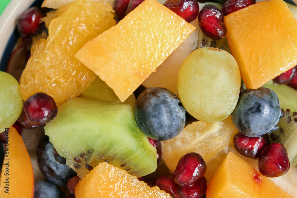 Fresh fruit salad as background, closeup