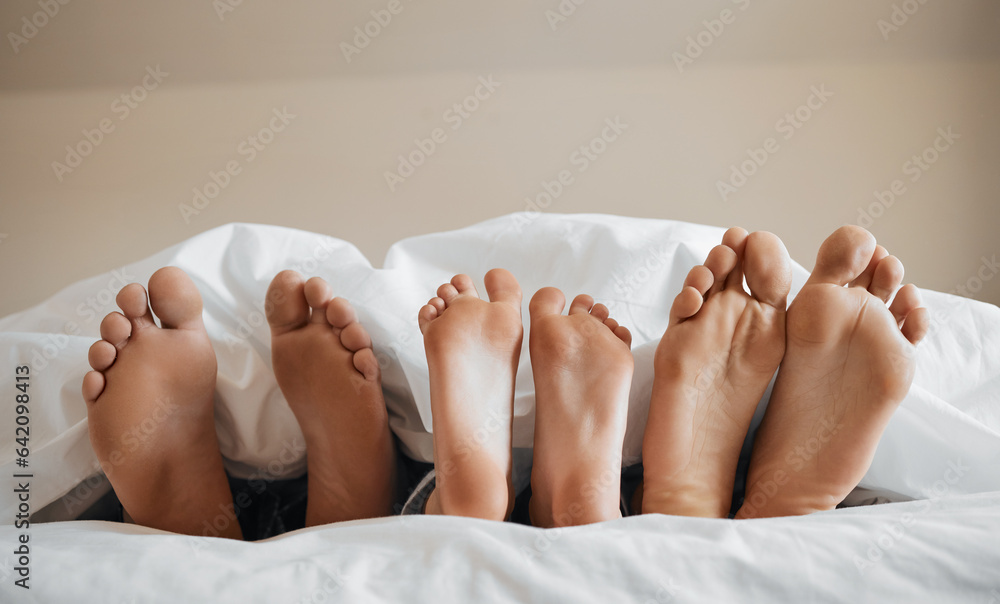 Feet, parents and kid sleeping on bed to relax with love, rest or sleeping on hotel mattress in morn