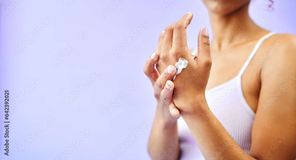 Dry skin, hands and woman with cream for studio skincare, cosmetics or wellness on purple background