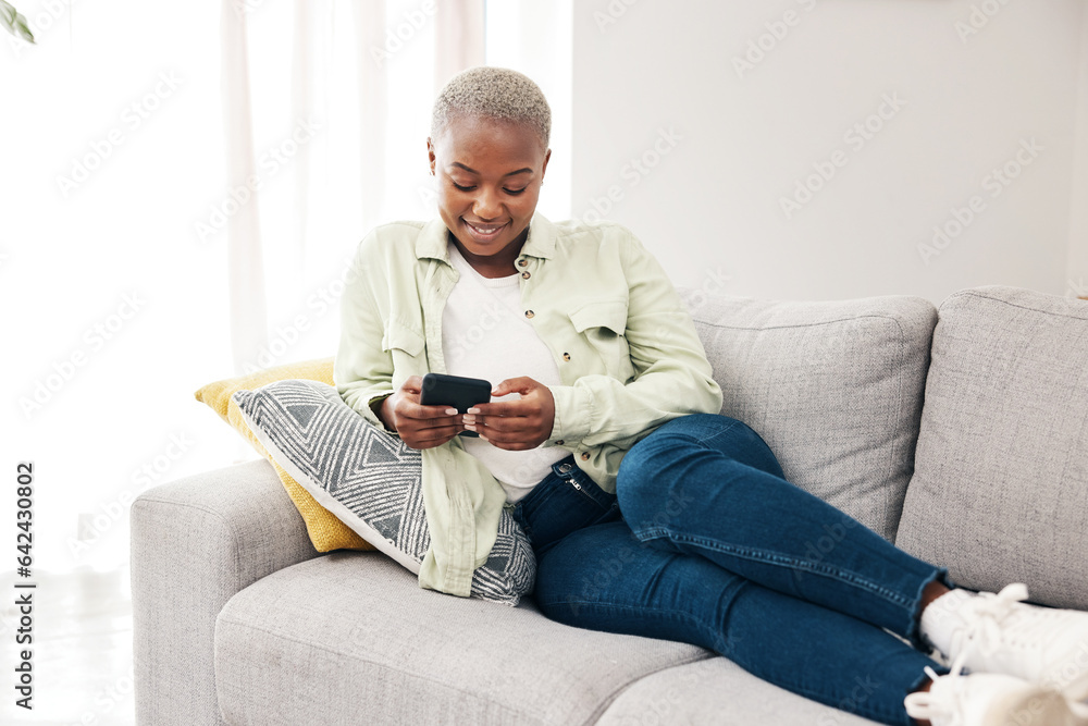 Happy black woman, smartphone and typing on sofa for social media post, digital contact and reading 