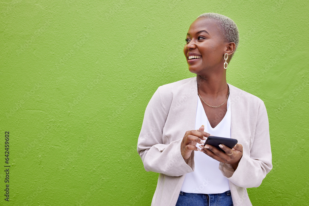 Woman, thinking and phone for communication by a wall or green background with internet. Happy Afric