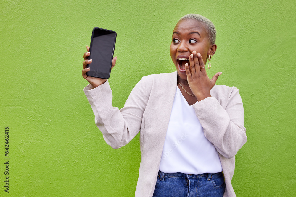 Surprise, woman and phone screen with mockup by a wall or green background with wow advertising. Sho