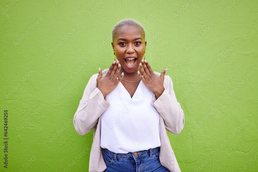 Excited, shocked and black woman surprise by news, deal or discount offer isolated in a studio green