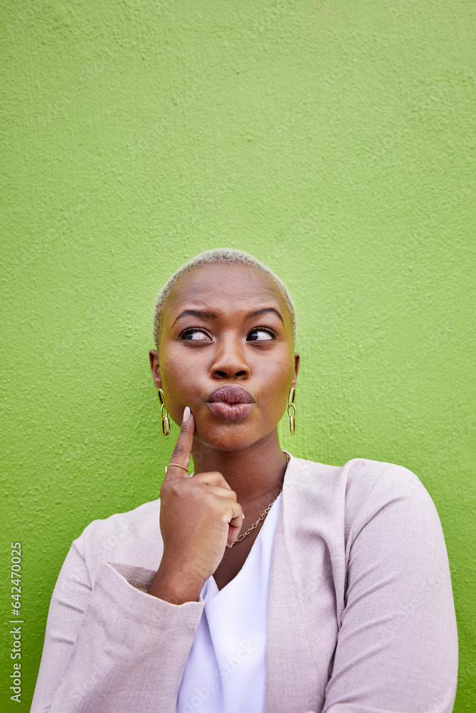 Thinking, idea and young black woman by a green wall with trendy, classy and elegant outfit for fash