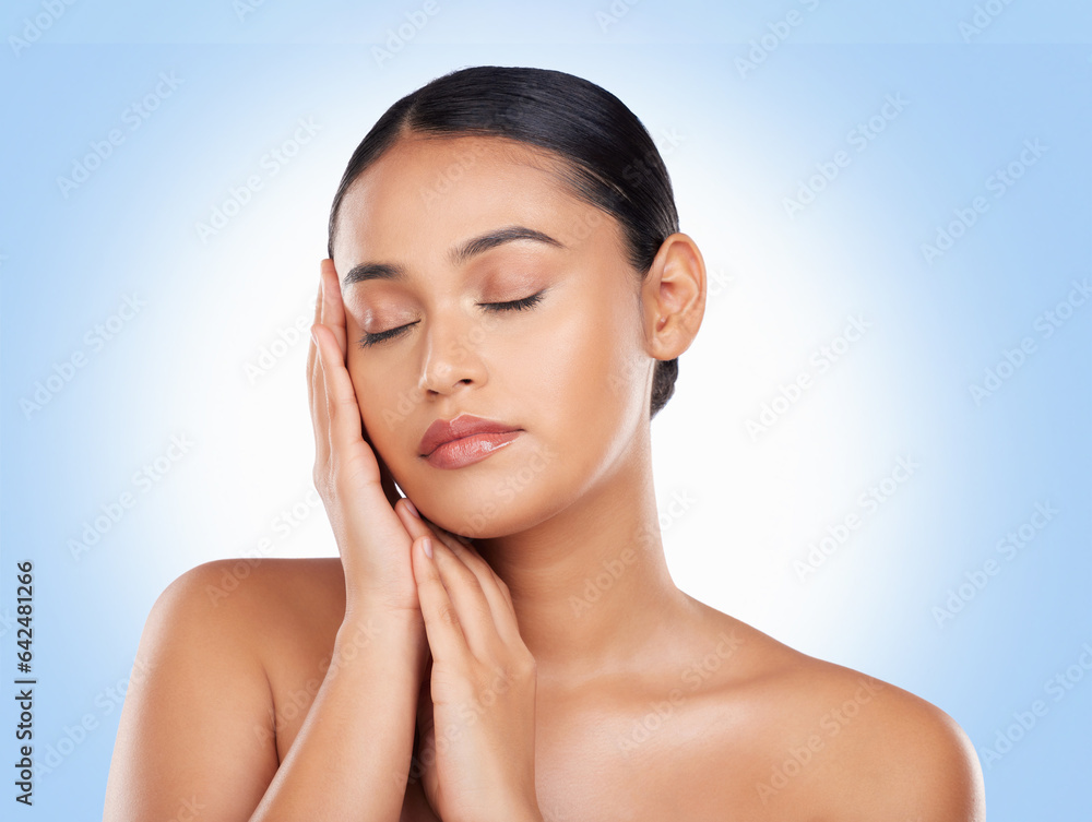 Skincare, beauty and woman with cosmetics, shine and dermatology on a blue studio background. Glow, 