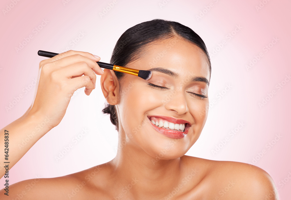 Happy, beauty and a woman with a brush on a pink background for skincare, wellness and health. Smile