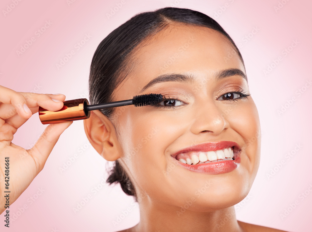 Portrait, makeup and a woman with mascara on a pink background for eyelash beauty in studio. Smile, 