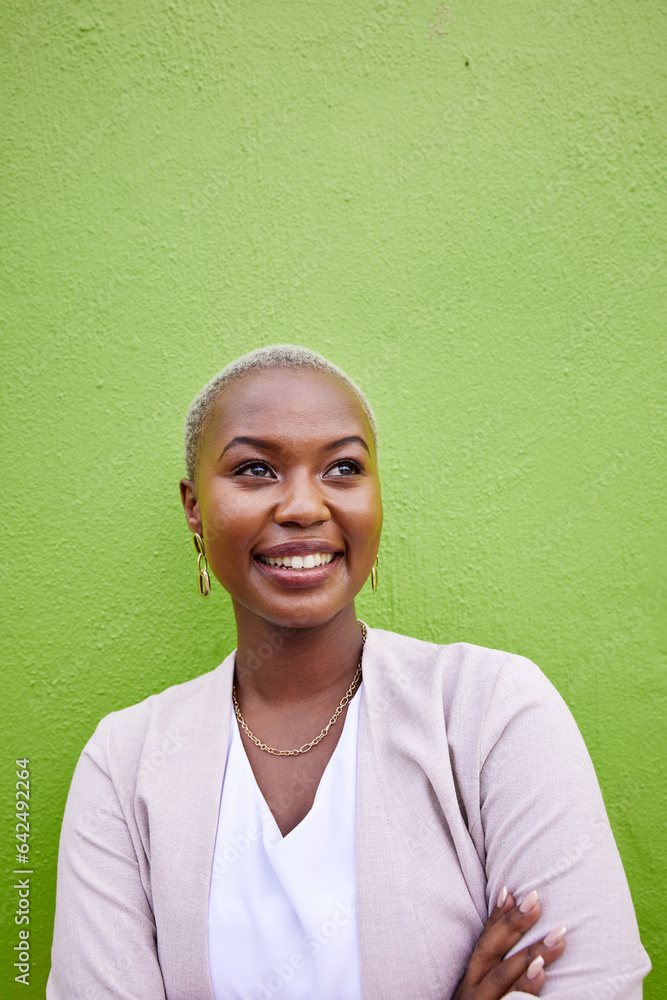 Happy, crossed arms and young black woman by a green wall with classy and elegant jewelry and outfit