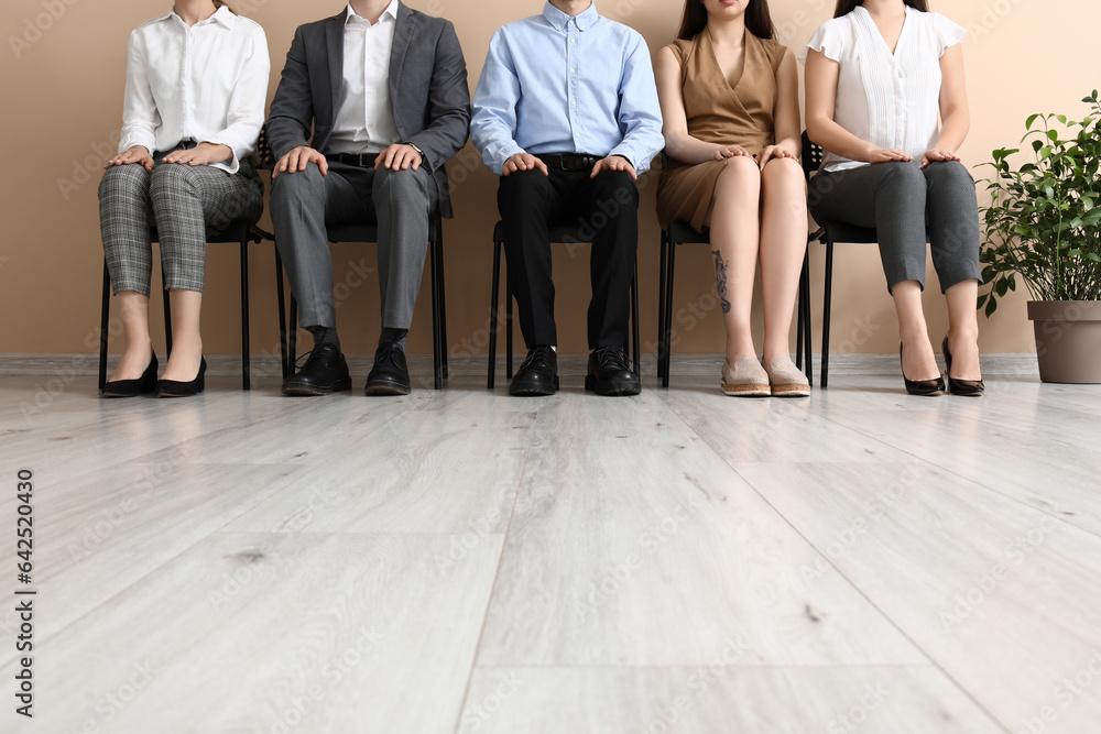 Young people waiting for job interview in room