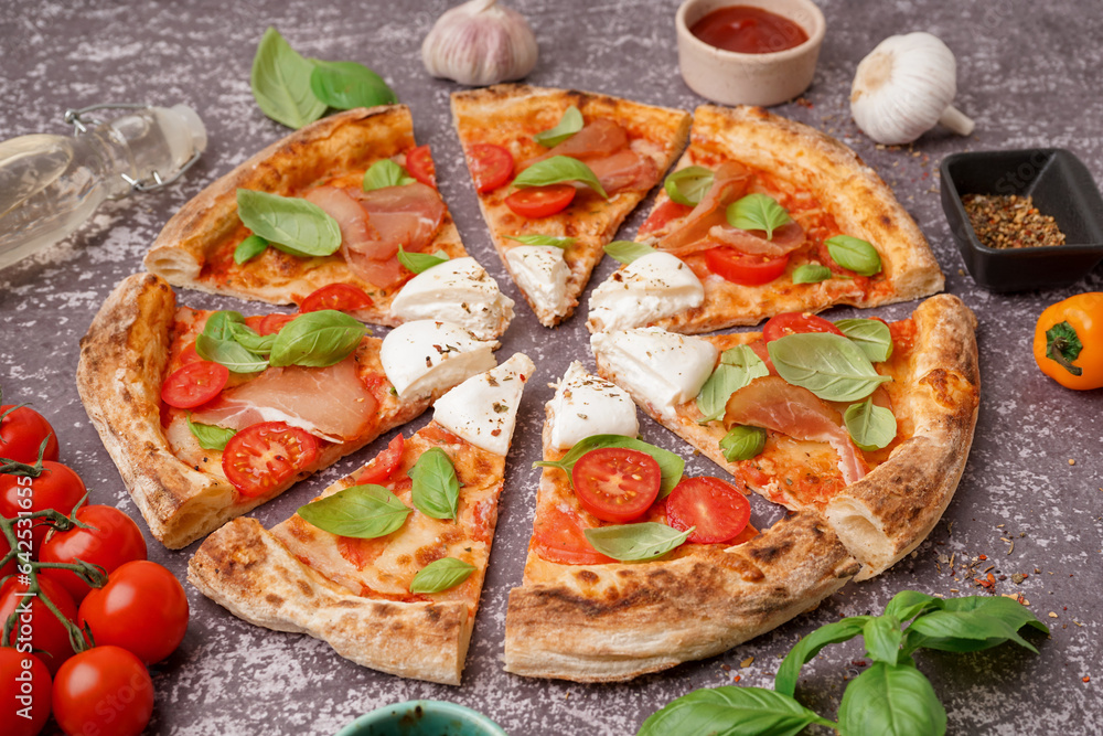 Slices of tasty pizza with Burrata cheese on grey background