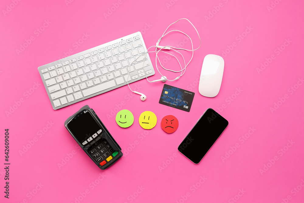 Rating smiles with gadgets, credit card and payment terminal on pink background. Customer experience