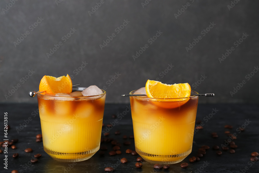 Glasses of cold orange espresso on table