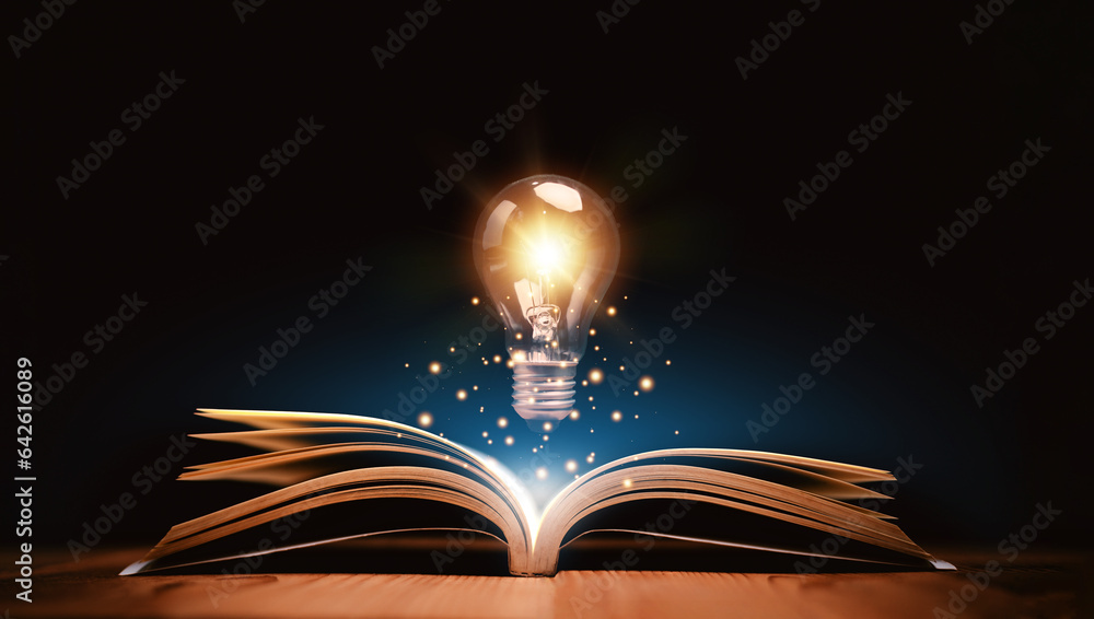 Glowing lightbulb over a book, Inspiring from read concept,  Education knowledge and business educat