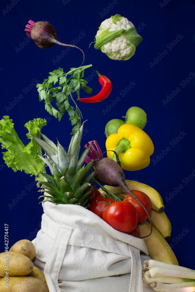 Vegetables and fruits flying into a shopping bag, supermarket, market, levitation