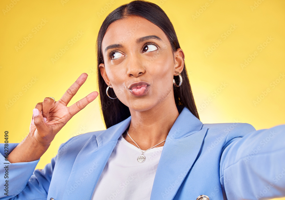 Business woman, peace sign and studio selfie with funny face, pouting and emoji by yellow background