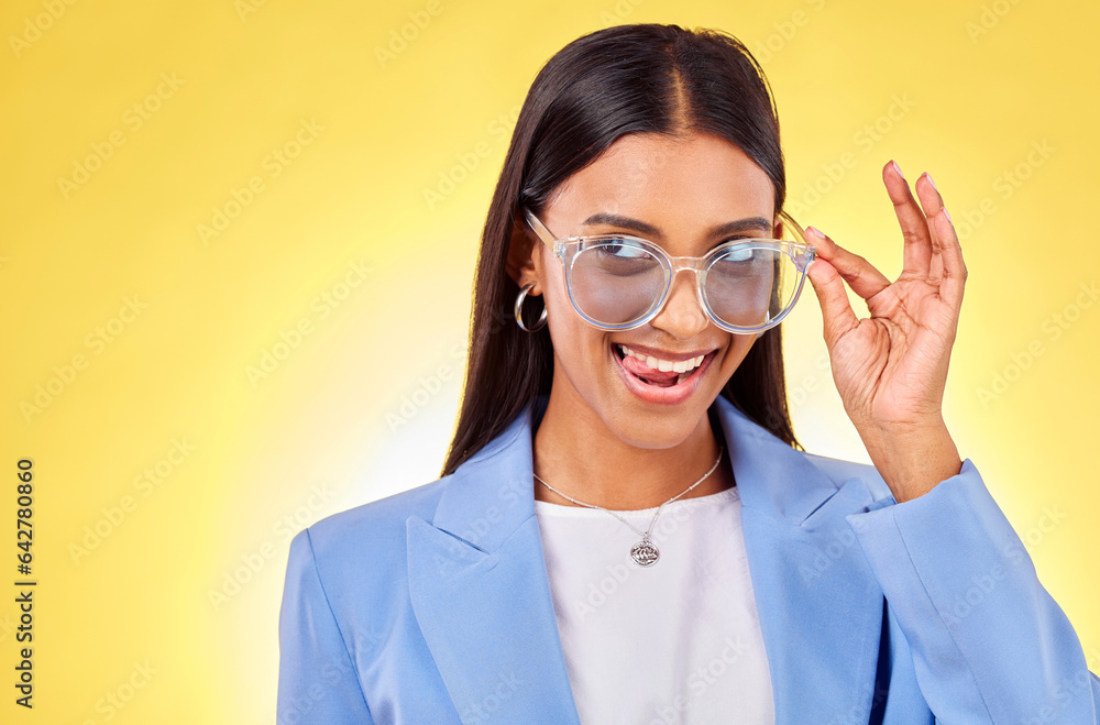 Funny, woman and sunglasses with tongue out, comedy and silly face in a studio. Yellow background, c