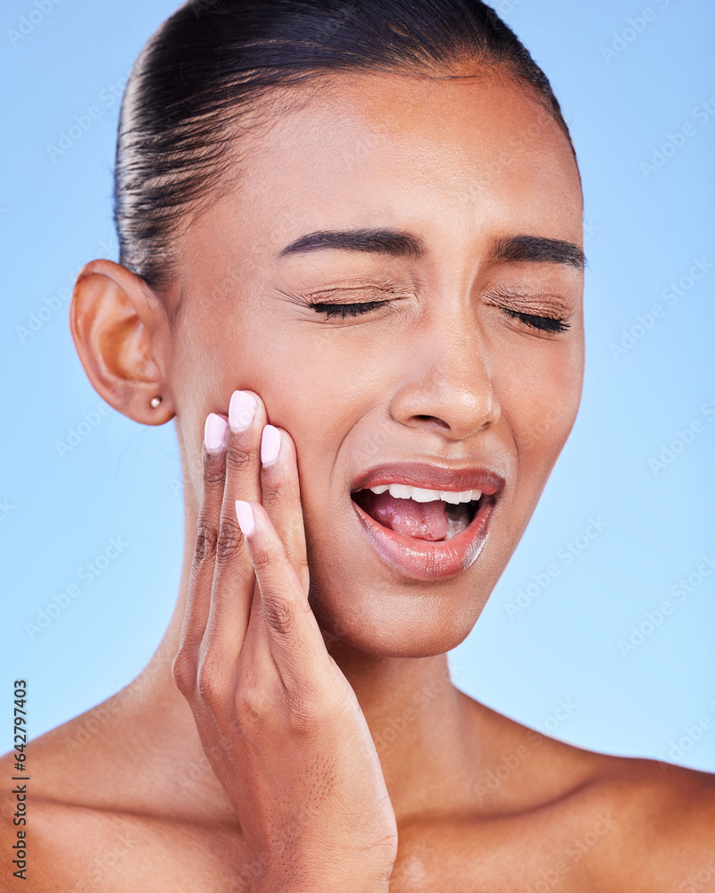 Toothache, cavity and a woman with mouth pain on a blue background with a dental emergency. Sad, acc