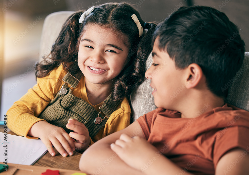 Girl, boy and siblings in home, learning and smile with book, toys and education at desk for develop