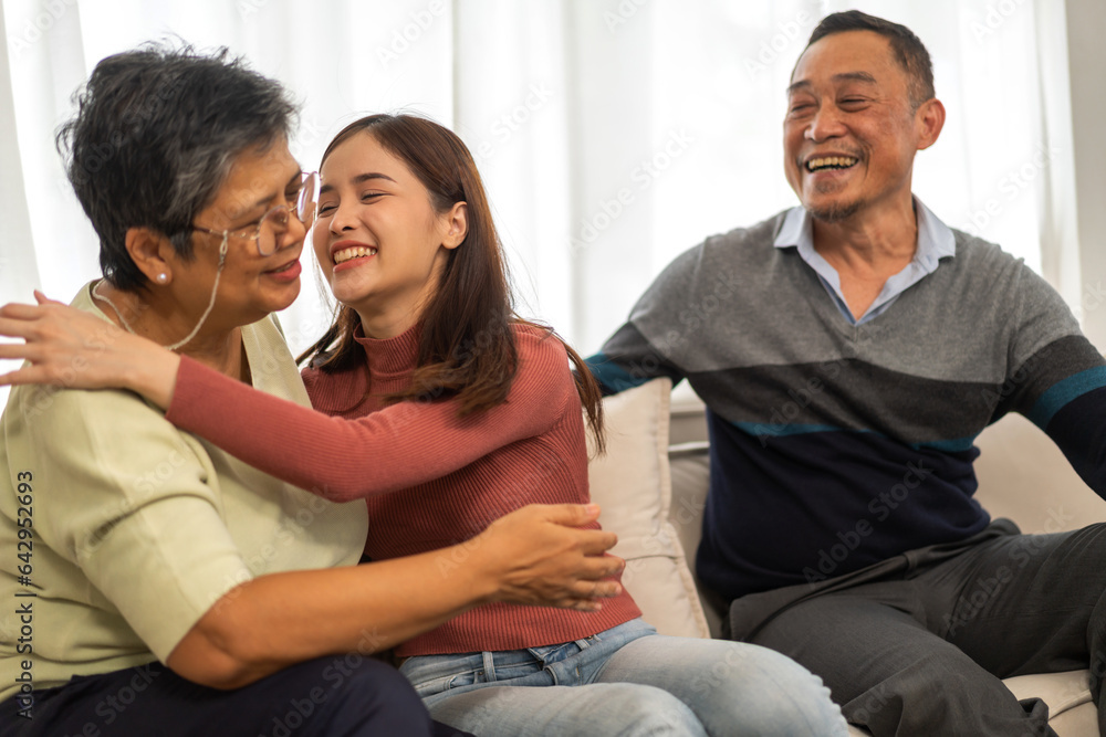 Portrait enjoy happy smiling love asian family.Senior mature father hug with elderly mother and youn