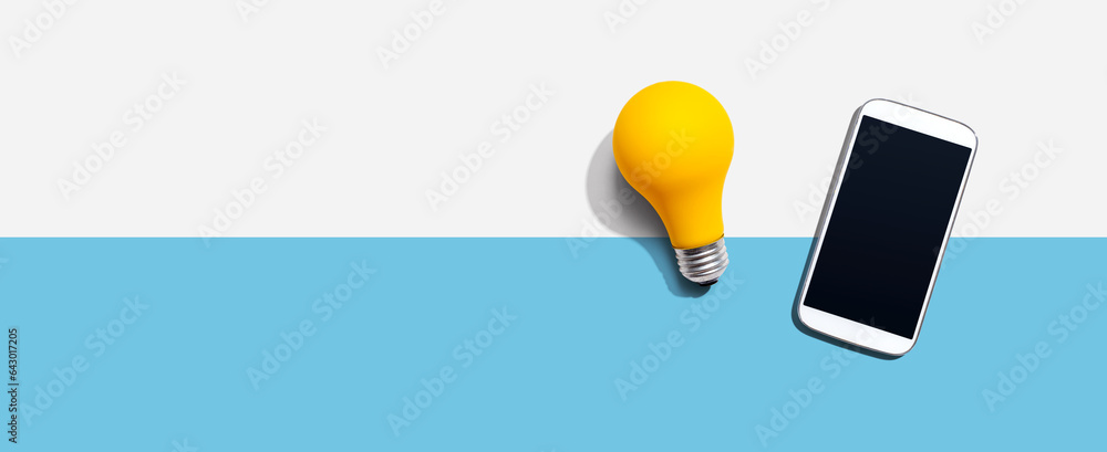 Smartphone with a yellow light bulb from above