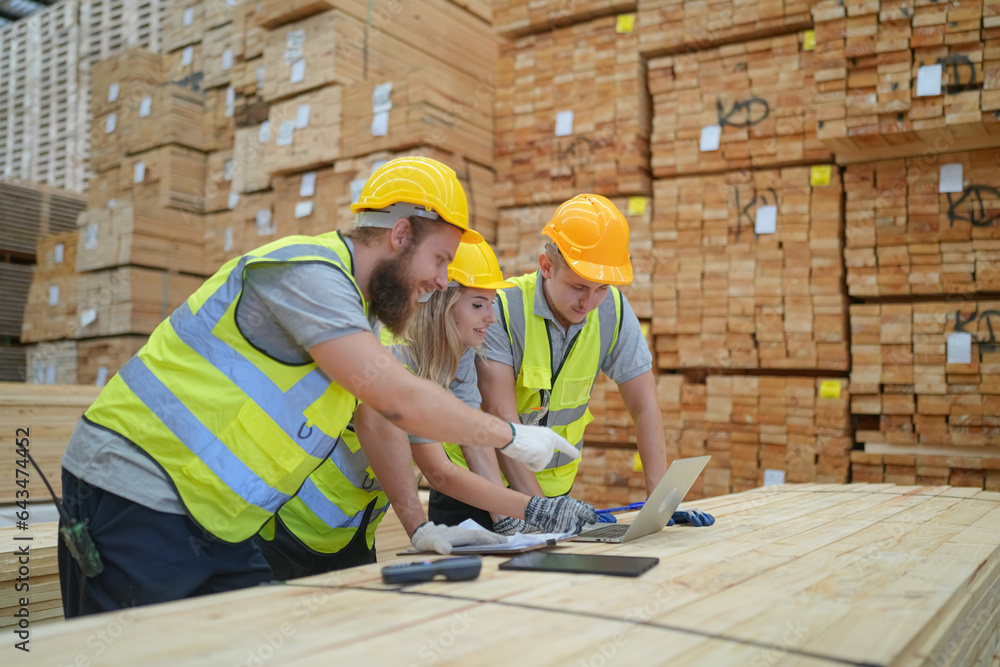 Warehouse worker working at lumber yard in Large Warehouse. Worker are  Inventory check at Storage s