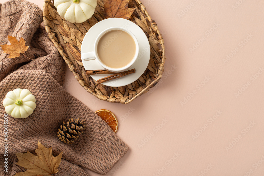 Autumn comfort visualized. Top view scene with sweater, fresh coffee in wicker garden basket, pattyp