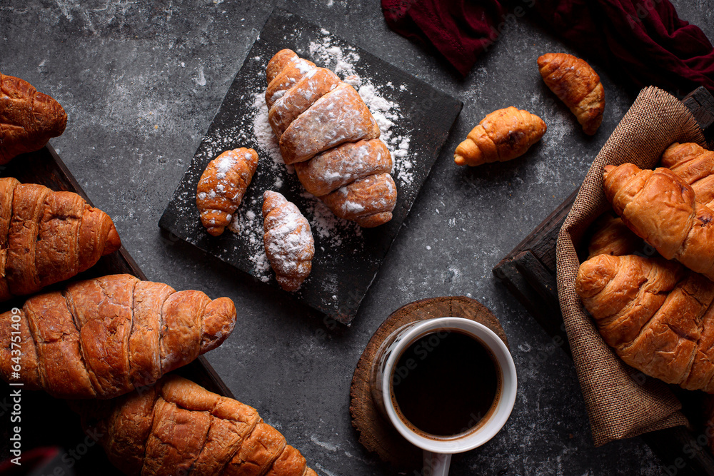 French croissant with powdered sugar from top view 