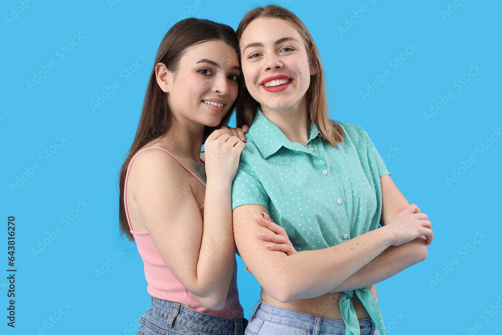 Female friends on blue background