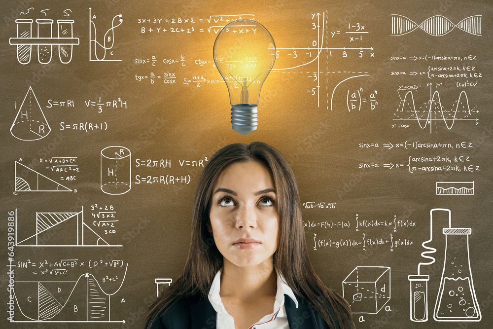 Portrait of attractive thoughtful young european businesswoman with glowing light bulb on chalkboard