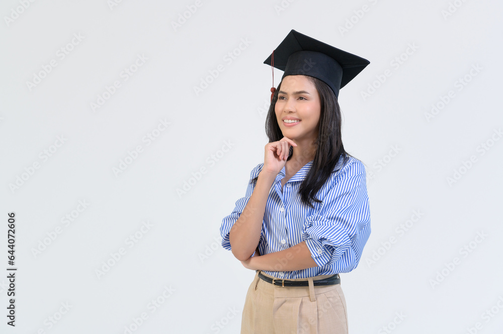 Portrait of happy Beautiful woman in graduation gown over white background