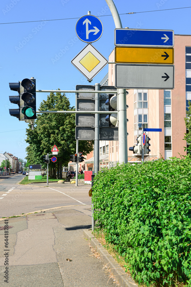 View of city street with traffic lights and road signs