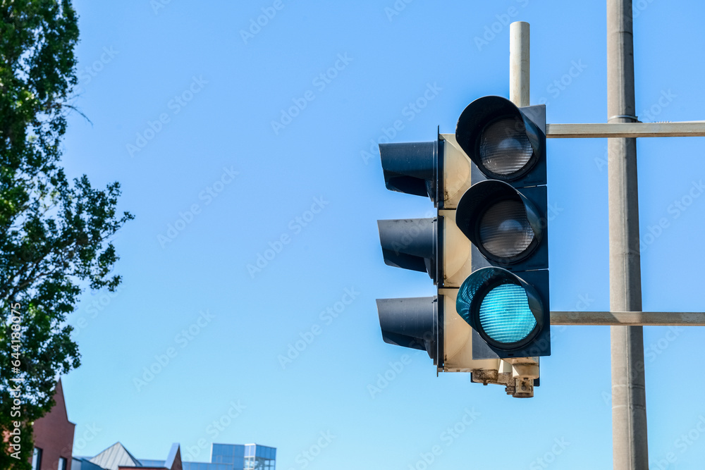 View of green traffic light in city, closeup