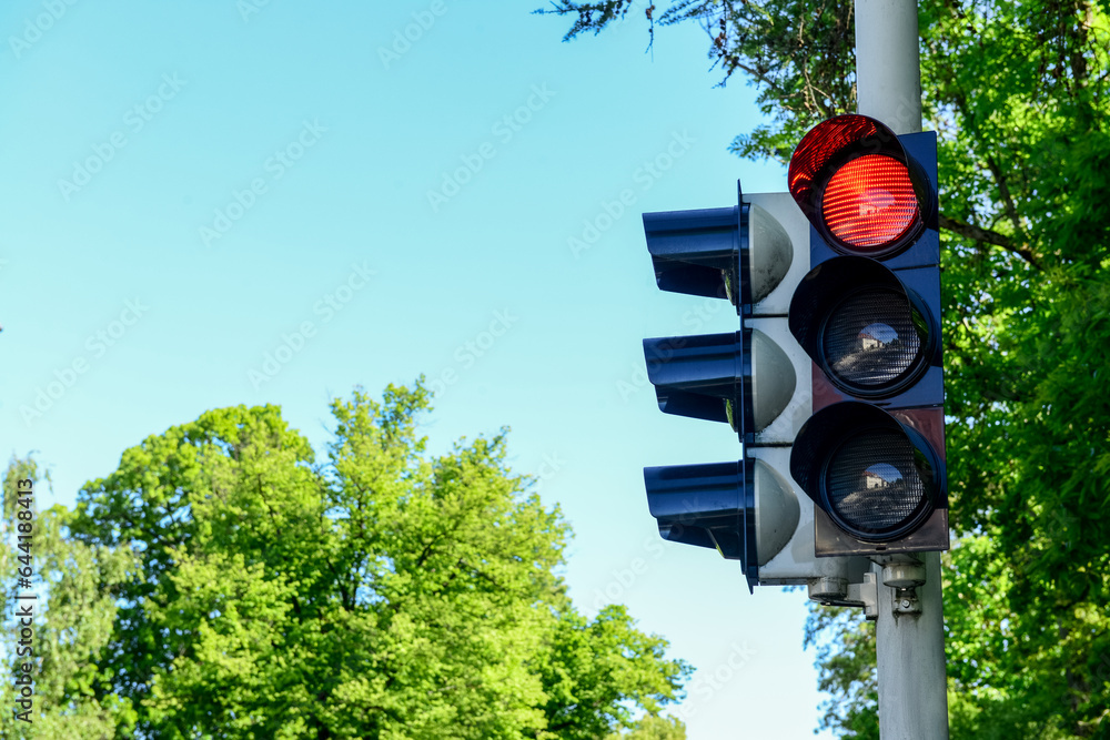 View of red traffic light in city, closeup