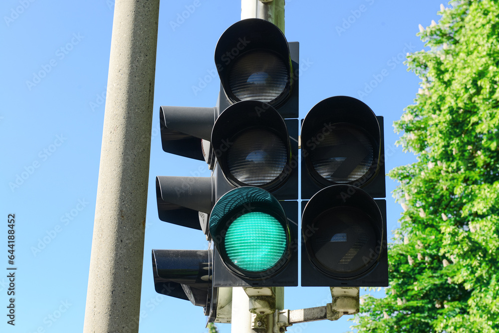 View of green traffic light in city, closeup