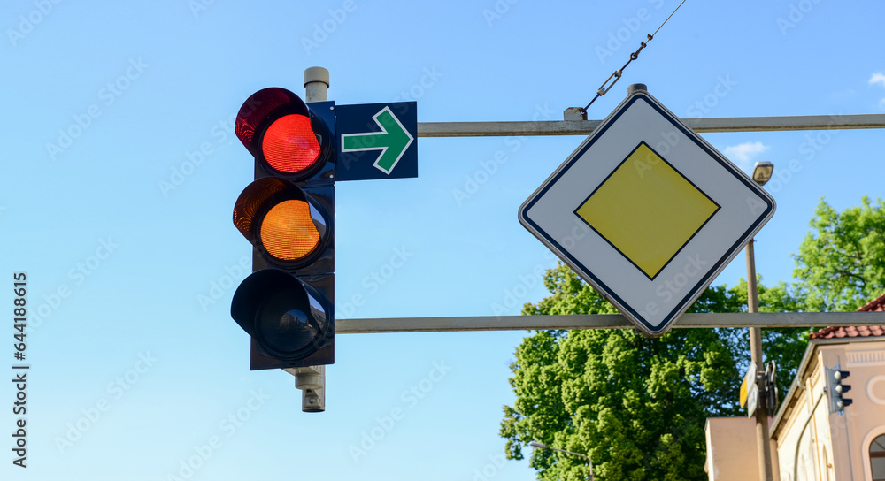 View of traffic lights with road signs in city, closeup