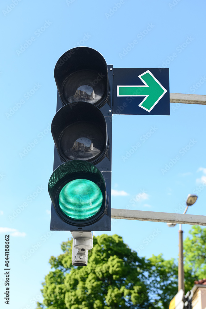 View of green traffic light in city, closeup