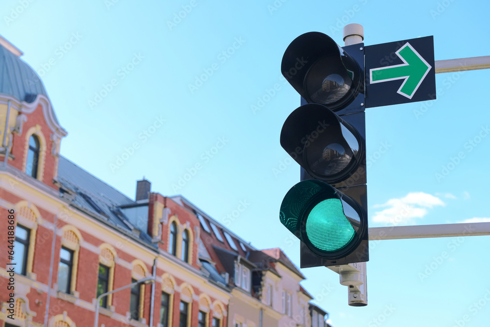 View of green traffic light in city, closeup