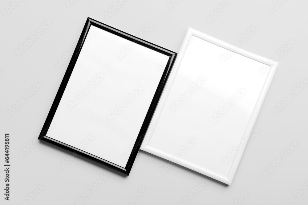 Blank picture frames on light background