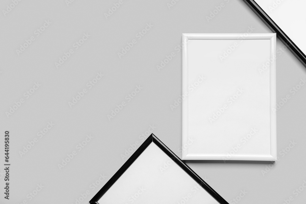 Blank picture frames on light background