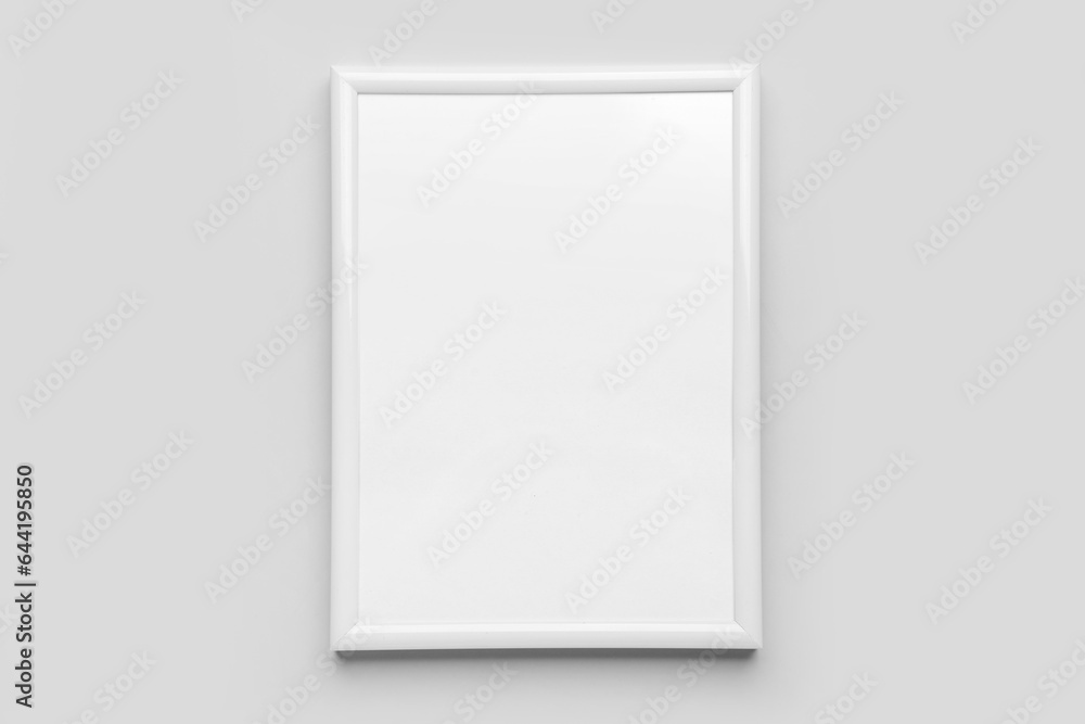 Blank picture frame on light background