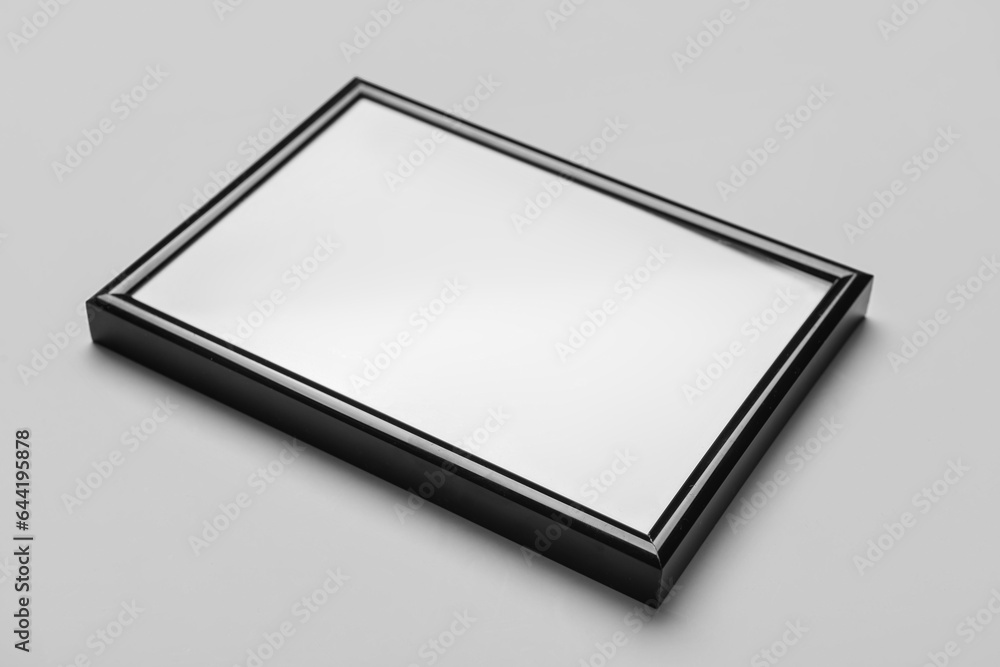 Blank picture frame on light background