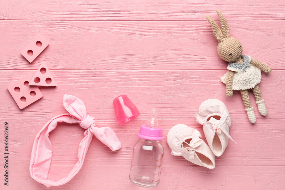 Composition with baby accessories and toys on color wooden background