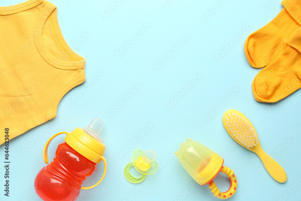 Composition with baby accessories and clothes on color background